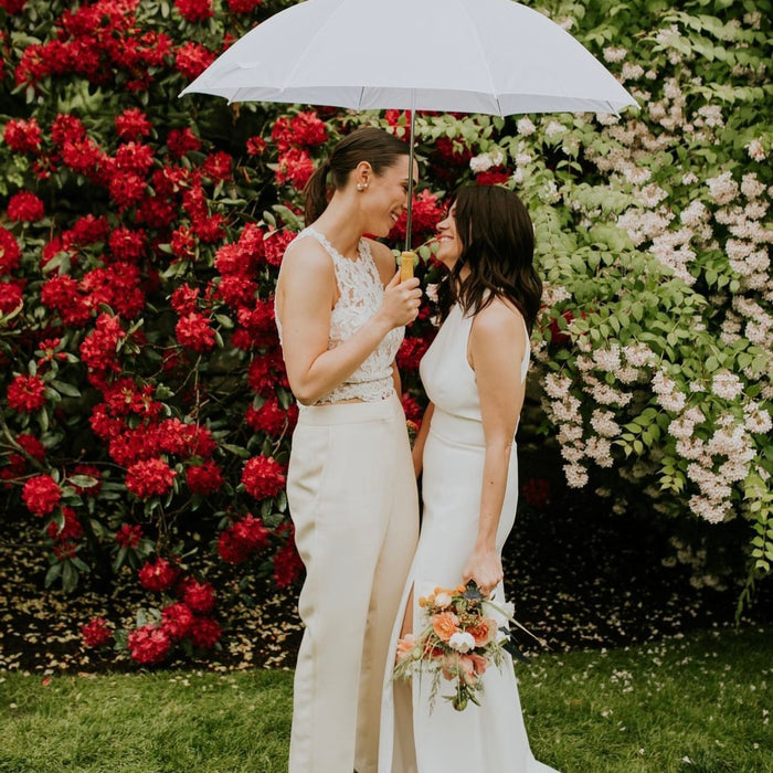 Georgie & Juliet kept it all white vibe with their umbrella. The showers were brief, but the love flowed!